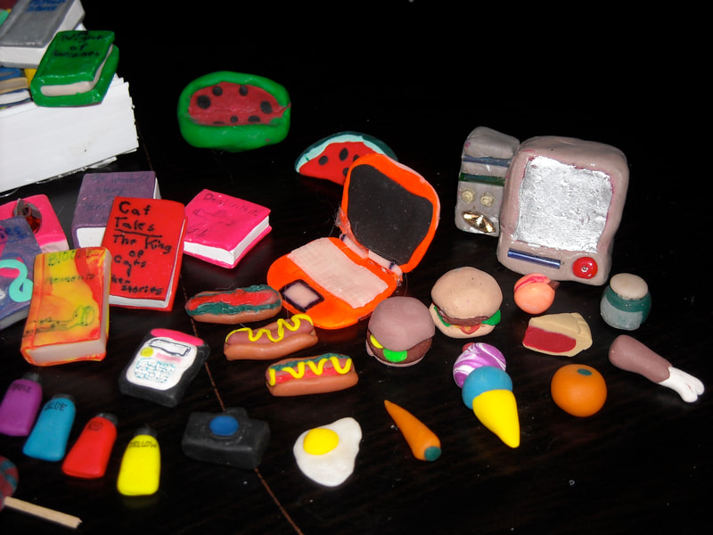 Assorted polymer clay sculptures I made for action figures and dolls as a child.