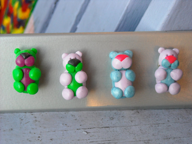 Brightly coloured cartoony bear magnets made of polymer clay