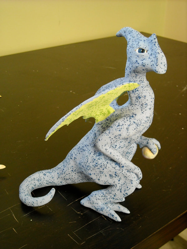 A large standing clay dragon glazed with a kind of textured blue glaze